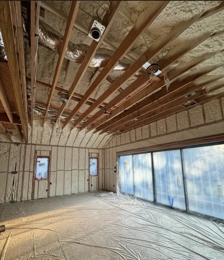 Interior walls and ceiling insulated with spray foam during new construction in Hobart